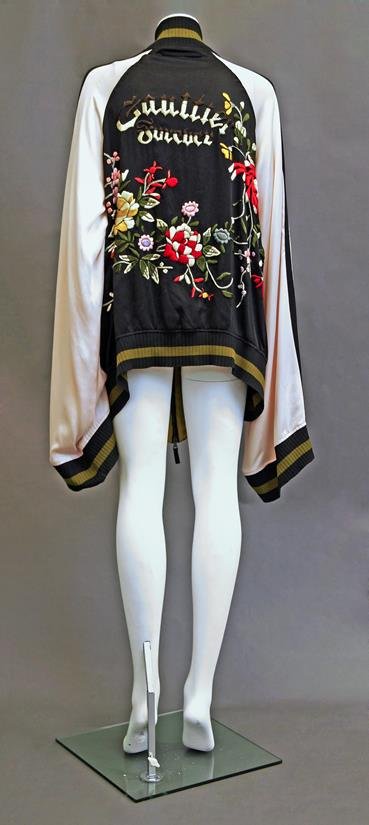 Jean Paul Gaultier: A Junior Gaultier oversized silk: Jean Paul Gaultier: A Junior Gaultier oversized silk bomber jacket, with extended overlong sleeves, the back with silk embroidered flowers and embroidered Junior Gaultier, lined in acid yellow silk ch