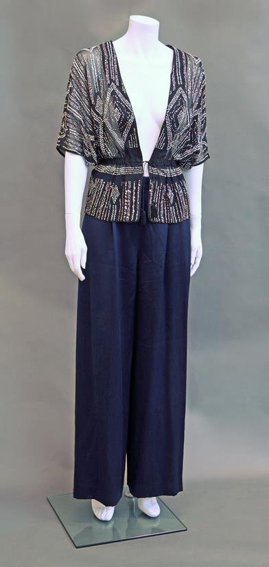 A collection of fashion to include a black chiffon and: A collection of fashion to include a black chiffon and beaded top, with batwing sleeves and drawstring waist, together with a pair of midnight blue sateen palazzo pants, both unlabelled, also an Alaï