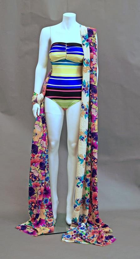 A Christian Lacroix swimsuit together with a quantity: A Christian Lacroix swimsuit together with a quantity of scarves, shawls and tote bags, to include an 1920s cream embroidered piano shawl, a scarf and shawl by Gianni Versace and a quantity of further