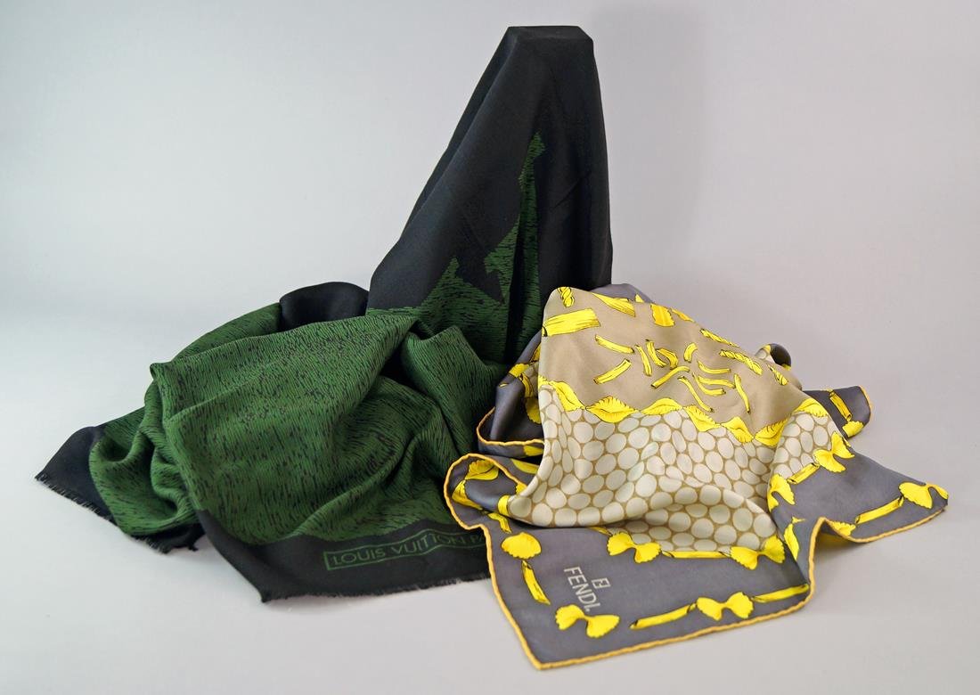 Louis Vuitton: A fine wool scarf, green on black: Louis Vuitton: A fine wool scarf, green on black ground, approx 136cm x 136cm, together with a Fendi silk scarf, yellow pasta shapes on a taupe and grey ground, approx 88cm x 85cm. (2)