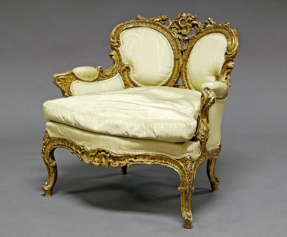 A Louis XVI-style gilt and upholstered armchair, the: A Louis XVI-style gilt and upholstered armchair, the back formed with two padded ovals, covered in green with green cushion, raised on cabriole legs, 70cm high x 71cm wide x 70cm deep
