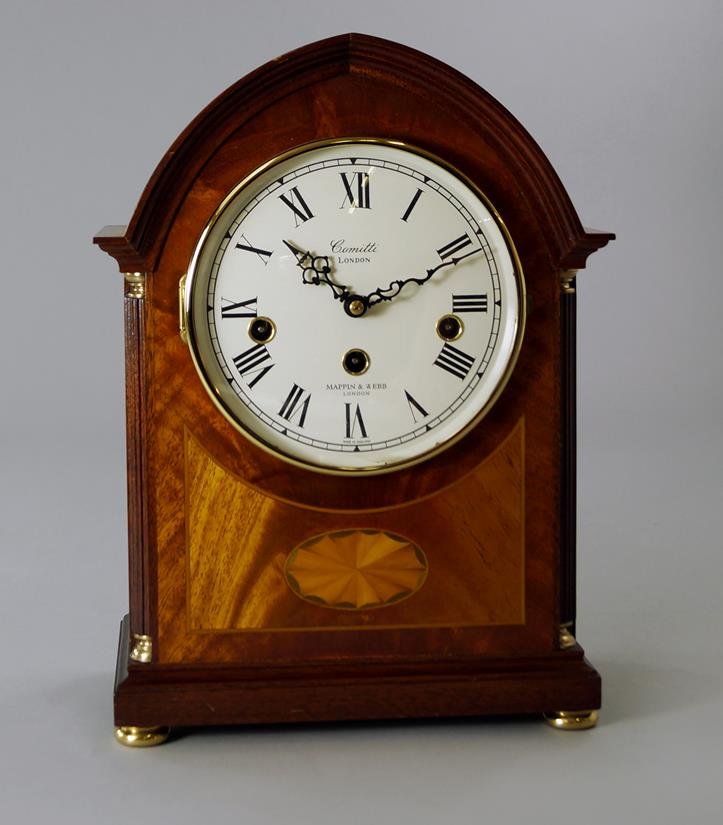A Mappin and Webb mahogany and veneered mantel clock,: A Mappin and Webb mahogany and veneered mantel clock, in the Edwardian taste, 20th century, signed to the dial ' Comitti London Mappin and Webb London', with a key, 30.8cm high