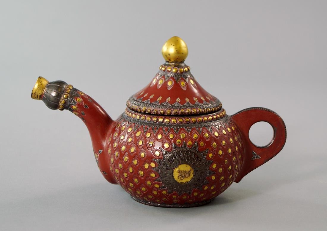A Turkish terracotta teapot, possibly 19th century,: A Turkish terracotta teapot, possibly 19th century, 14cm. high