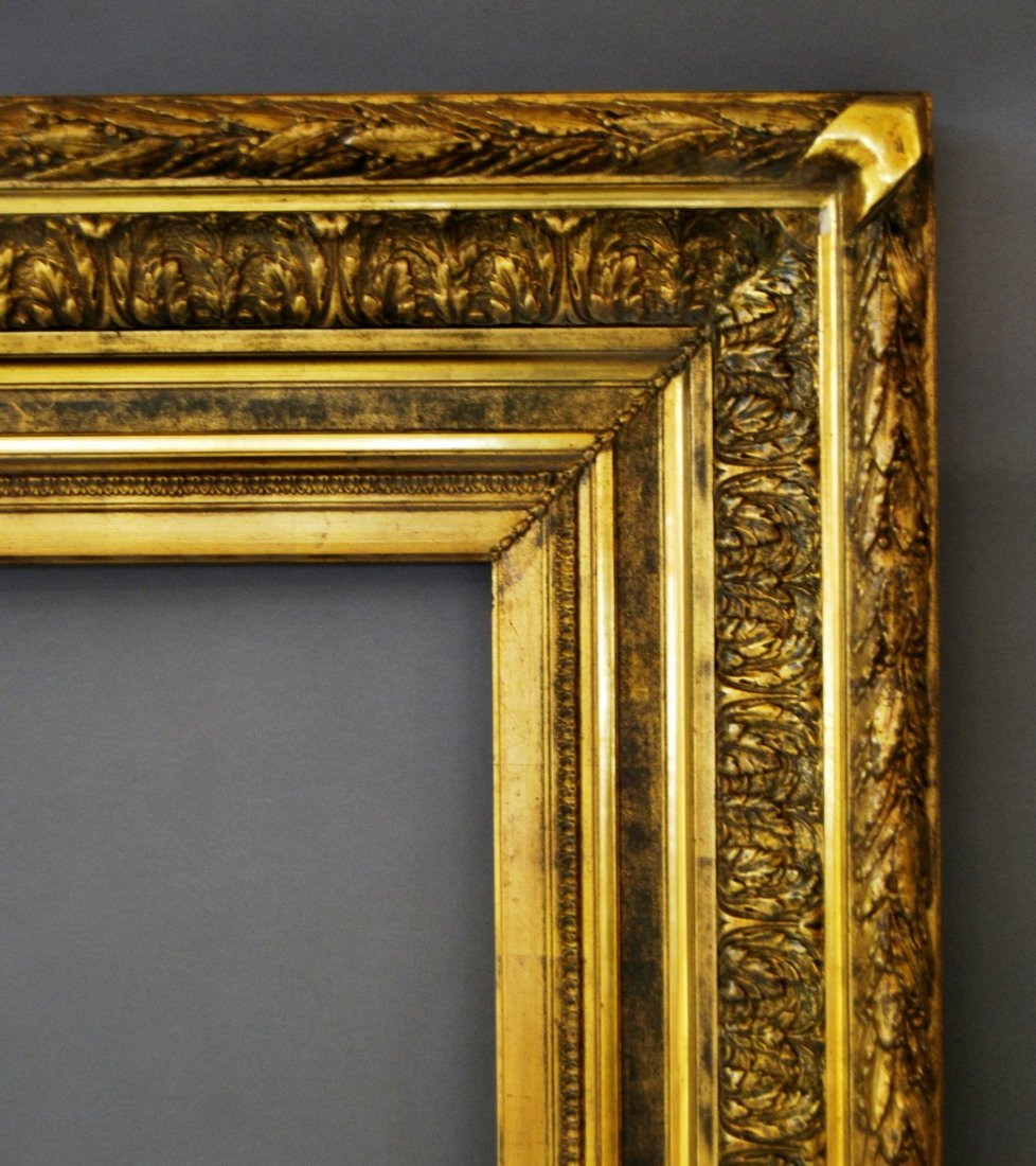 A Gilt Composition Neoclassical Style Frame, mid-late: A Gilt Composition Neoclassical Style Frame, mid-late 19th century, with cavetto sight, leaf, sanded frieze, the plain ogee with acanthus, the front edge with ribbon-tied laurel leaf and berry, guillo