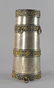 A Tibetan white metal and gilt powder flask, of