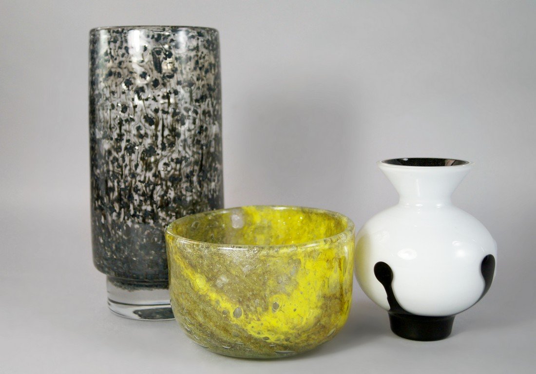 A Holmegaard high-sided glass bowl designed by Sidse: A Holmegaard high-sided glass bowl designed by Sidse Werner, late 20th centruy, with yellow coloured glass with air inclusions cased in clear, engraved marks HG SW 5002 to the underside, 8cm high 12cm