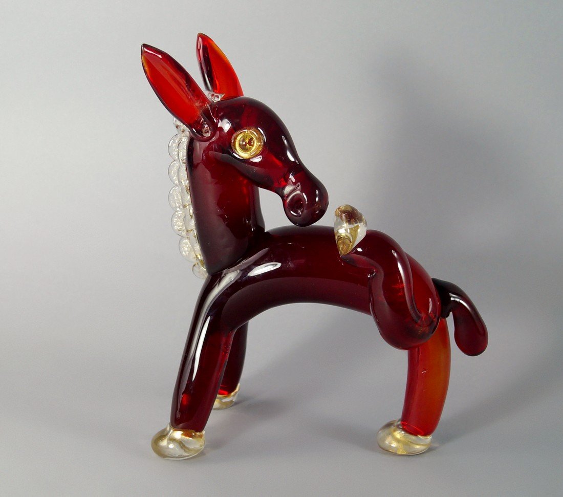 An Artisti Barovier red art glass horse figure by: An Artisti Barovier red art glass horse figure by Ercole Barovier, 1930s, approx 28cm x 21cm. (af)