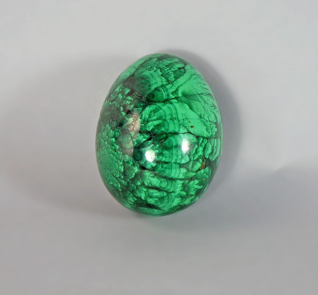 A malachite egg, possibly 19th/20th century, 7.5cm high: A malachite egg, possibly 19th/20th century, 7.5cm high