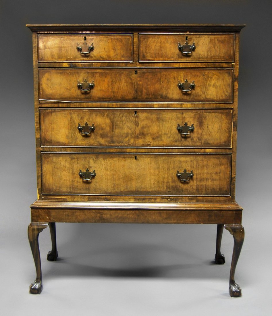 A George III mahogany chest of drawers on later stand,: A George III mahogany chest of drawers on later stand, 18th century and later, two short drawers over three long, raised on cabriole legs, 134cm high x 103cm wide x 48cm deep.