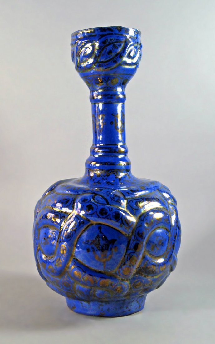 A Persian blue gilt lustre mallet vase, 18th century,: A Persian blue gilt lustre mallet vase, 18th century, overall decorated with stylized pattern, 35 cm high.