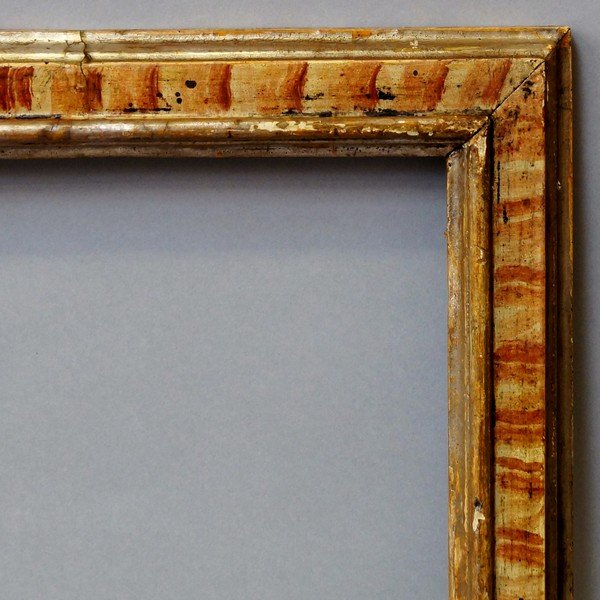 An Italian Polychrome Painted and Parcel Silvered: An Italian Polychrome Painted and Parcel Silvered Cassetta Frame, 18th century, with cavetto sight, torus and reverse ogee back edge, 43.8x53cm