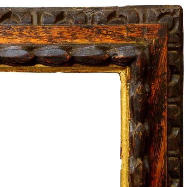 An Italian Polychrome Painted and Parcel Gilded: An Italian Polychrome Painted and Parcel Gilded Cassetta Frame, 17th century, with cavetto sight, the front edge with centre tied raked bud in high relief, marbleized frieze and lozenge leaf back edge