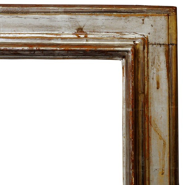 An Italian Silvered Cassetta Frame, 17th century, with: An Italian Silvered Cassetta Frame, 17th century, with cavetto sight, ogee front edge, reverse hollow, plain frieze and cushion moulded back edge, 66.5x51.5cm