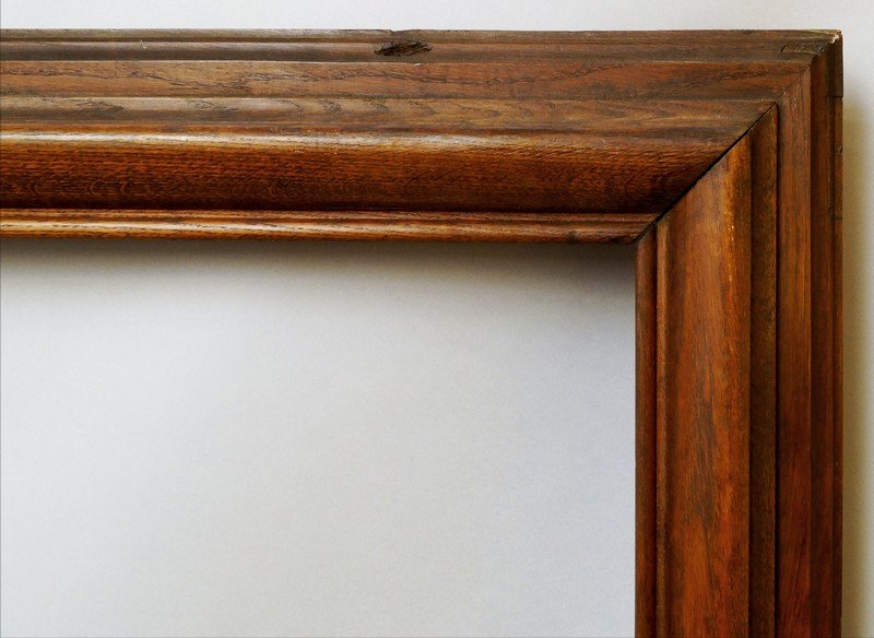 An Oak Bolection Moulding Frame, late 19th century,: An Oak Bolection Moulding Frame, late 19th century, with torus sight, plain top knull, reverse ogee and stepped back edge, 142x70cm