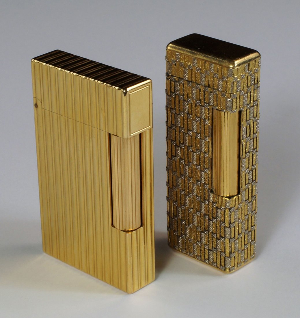 An 18ct bi-colour gold cigarette lighter, Boucheron,: An 18ct bi-colour gold cigarette lighter, Boucheron, Paris, of textured basketwork design, approx 102.6g, together with a gilt metal cigarette lighter, Dupont, Paris, of ribbed form. (2)
