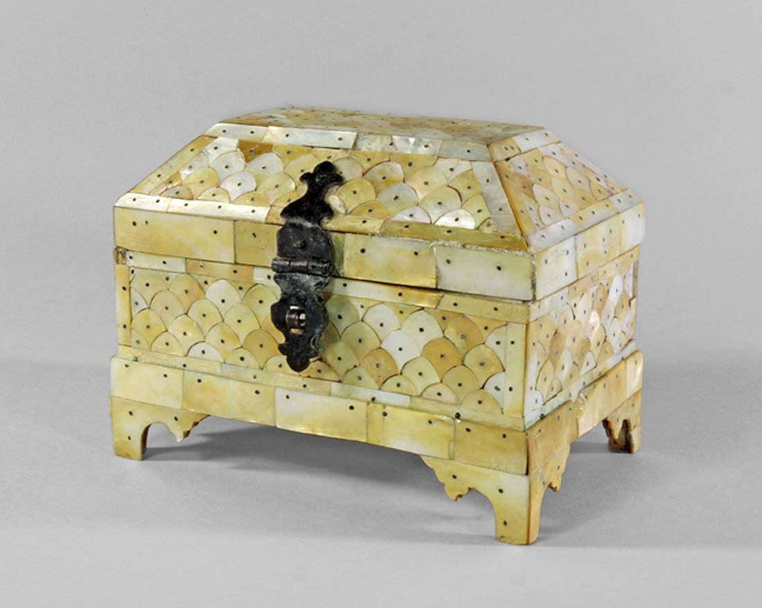 An Indian mother of pearl veneer casket, 19th century,: An Indian mother of pearl veneer casket, 19th century, the hinged top of domed faceted form, the rectangular body on bracket feet, 13cm high