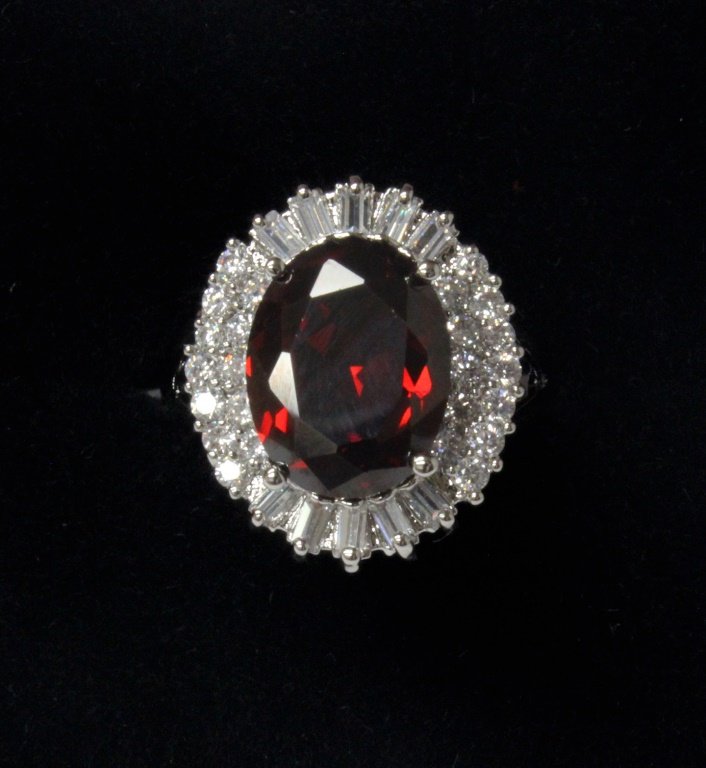 Garnet and white topaz estate ring set in sterling: Garnet and white topaz estate ring set in sterling silver. Ring size: 9.5