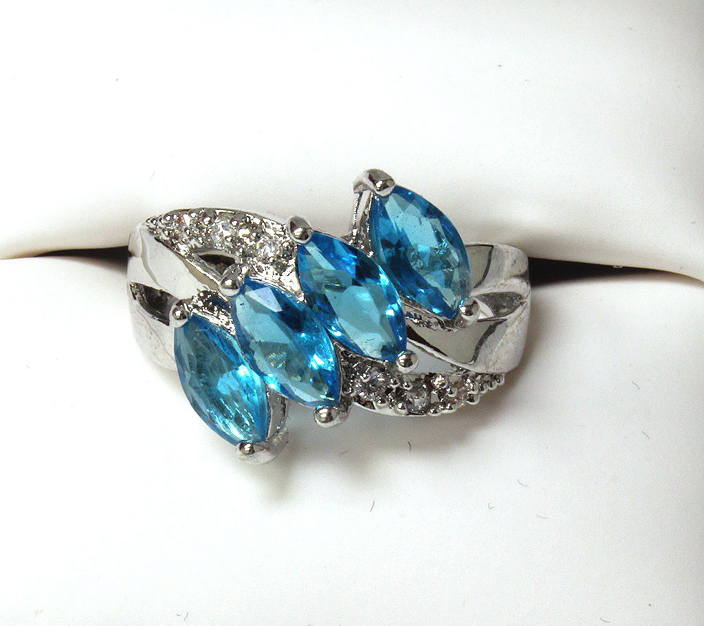 4 stone blue topaz evening ring set in SS (1 of 2)