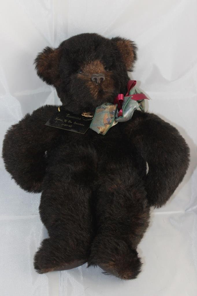 Carol Black - C.B. Originals in black Mohair: Coconina - 288. Carol Black - C.B. Originals in black and brown Mohair from Germany. 19" H in excellent condition. A pellet stuffed bear made to be held under his arms. Burgandy ribbon bow and green p