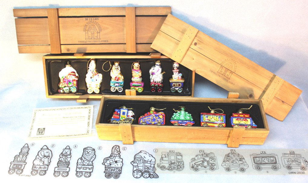 Thomas Pacconi Classics Ornaments, Set of 2: Thomas Pacconi Classics Christmas ornaments. Set of 2 boxes. 2003 collection comes with 6 colorful hand painted, hand blown circus animals, comes with certificate of authenticity. 2004 collection with