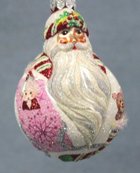Patricia Breen "Santa Du Monde" Ornaments: Patricia Breen "Santa Du Monde" miniature Christmas ornament. Limited quantities were available in a fully glittered recoloration of red and white stipes, pink and green. The round Santa is decorated 