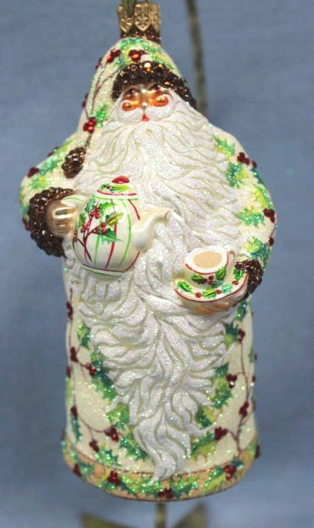 Patricia Breen "Connaught Santa" Ornament: Patricia Breen "Connaught Santa" jeweled holly Christmas ornament. The holly berries and the trim on Santa's cap and cuffs are crystals. Pearl white, red, and green. Stand not included. Size: 5.2" H