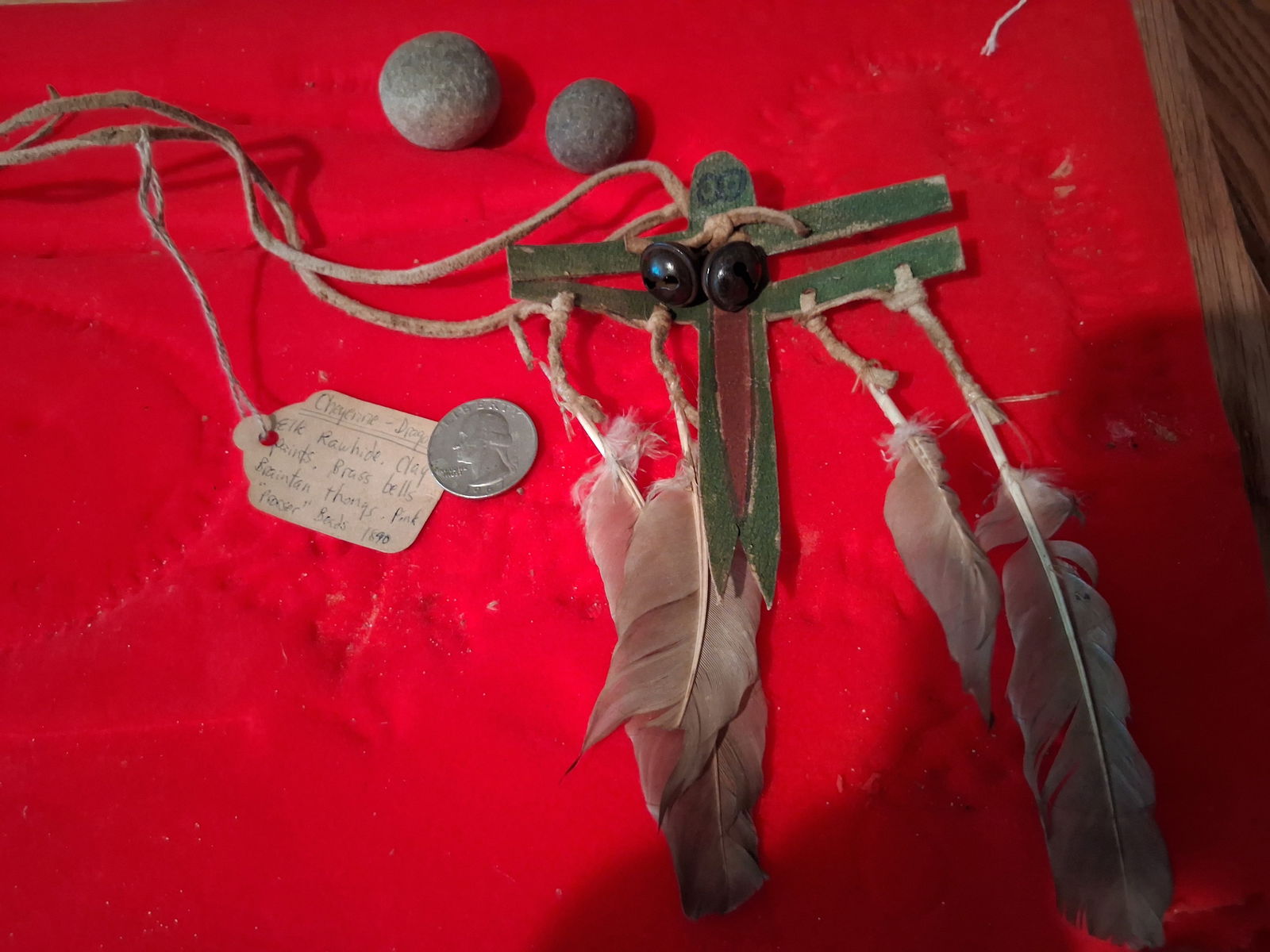 Cheyenne Dragonfly and Stone Balls: Elk rawhide. Clay paints. Brass bells. Braintan thongs. Pink prosser beads.