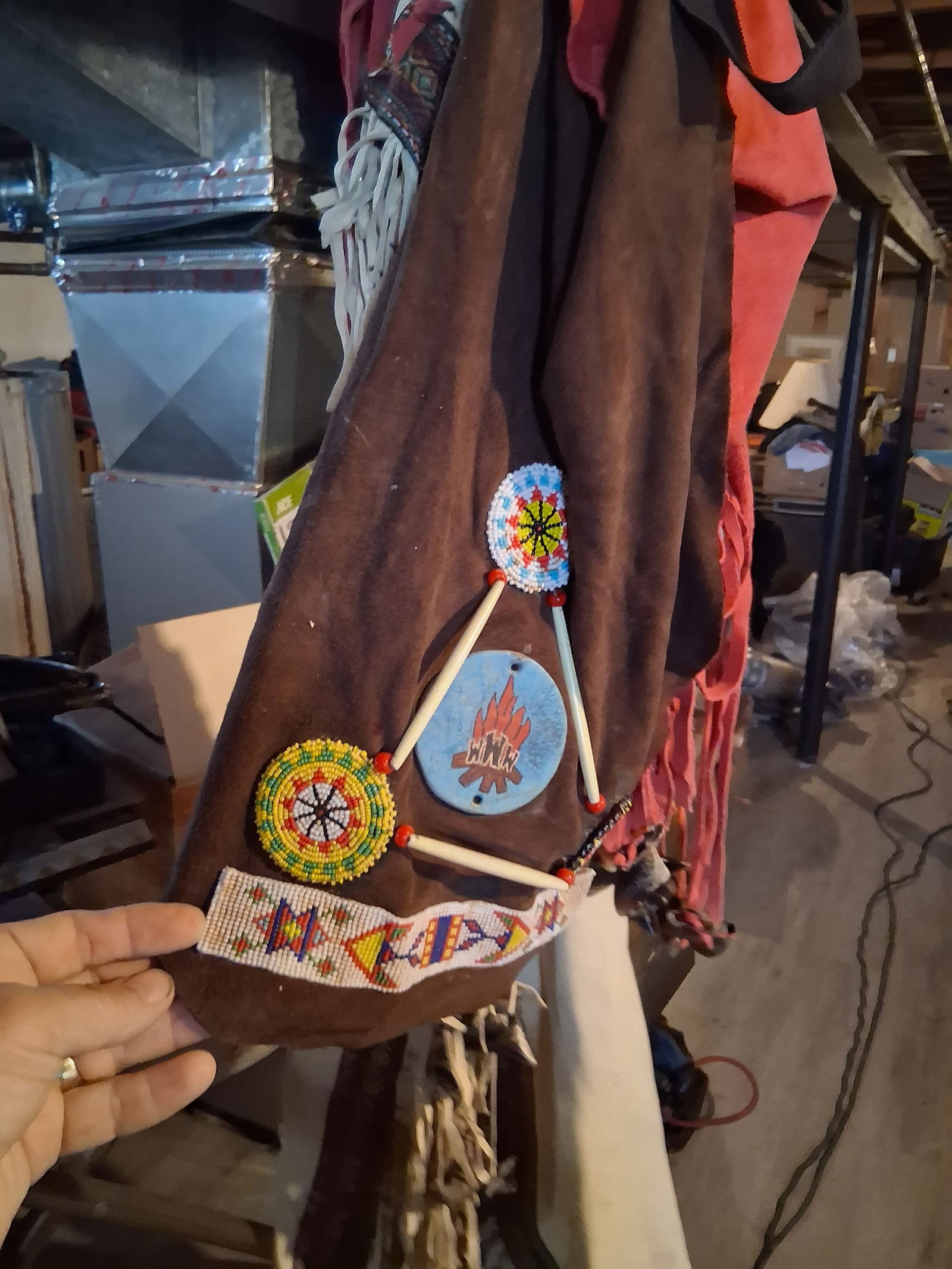 Tribal Costume Dress: Ceremonial tribal dress with embellishments.