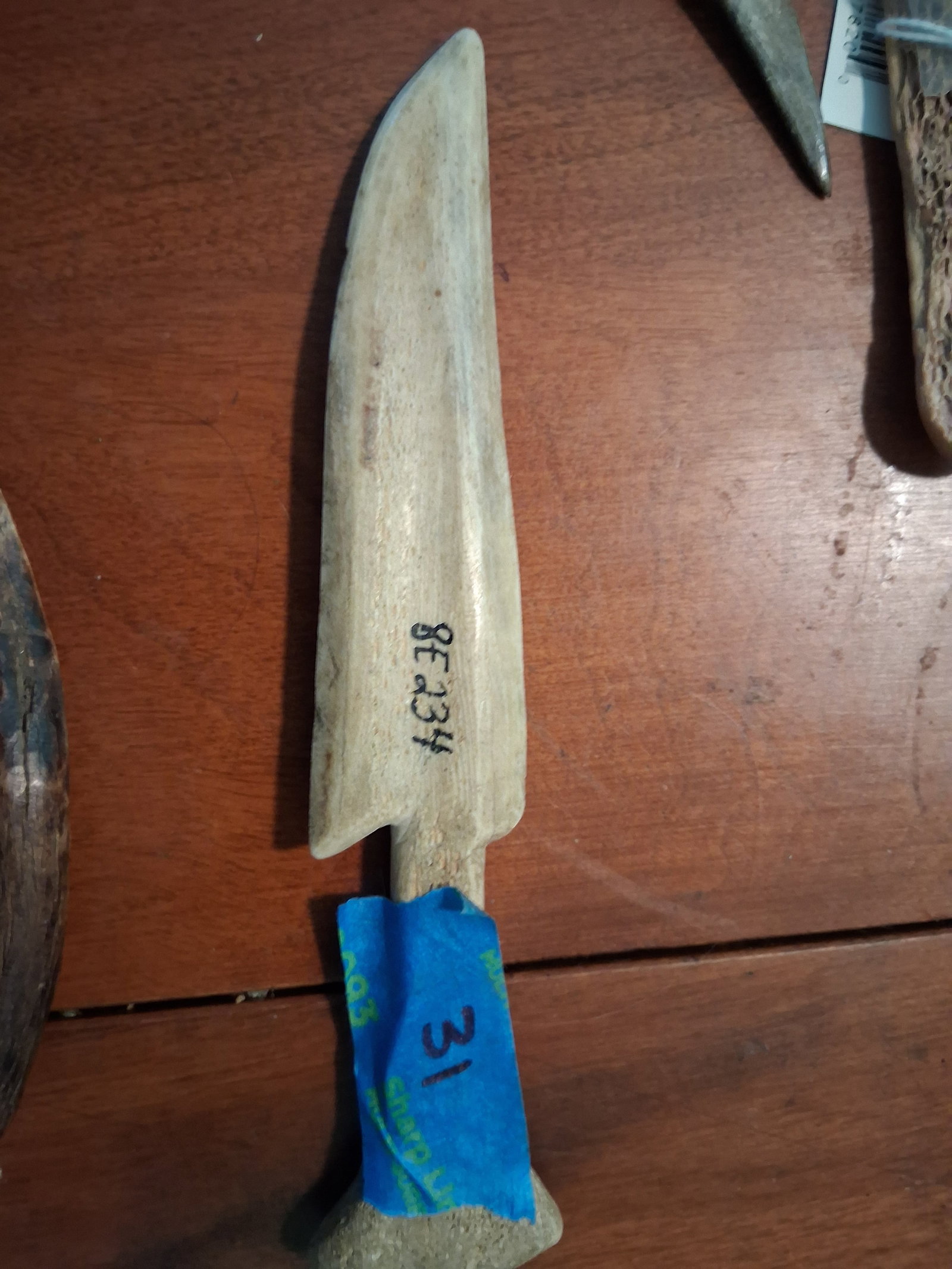 Bone Knife: Bone tool. Exquisitely carved antique example.