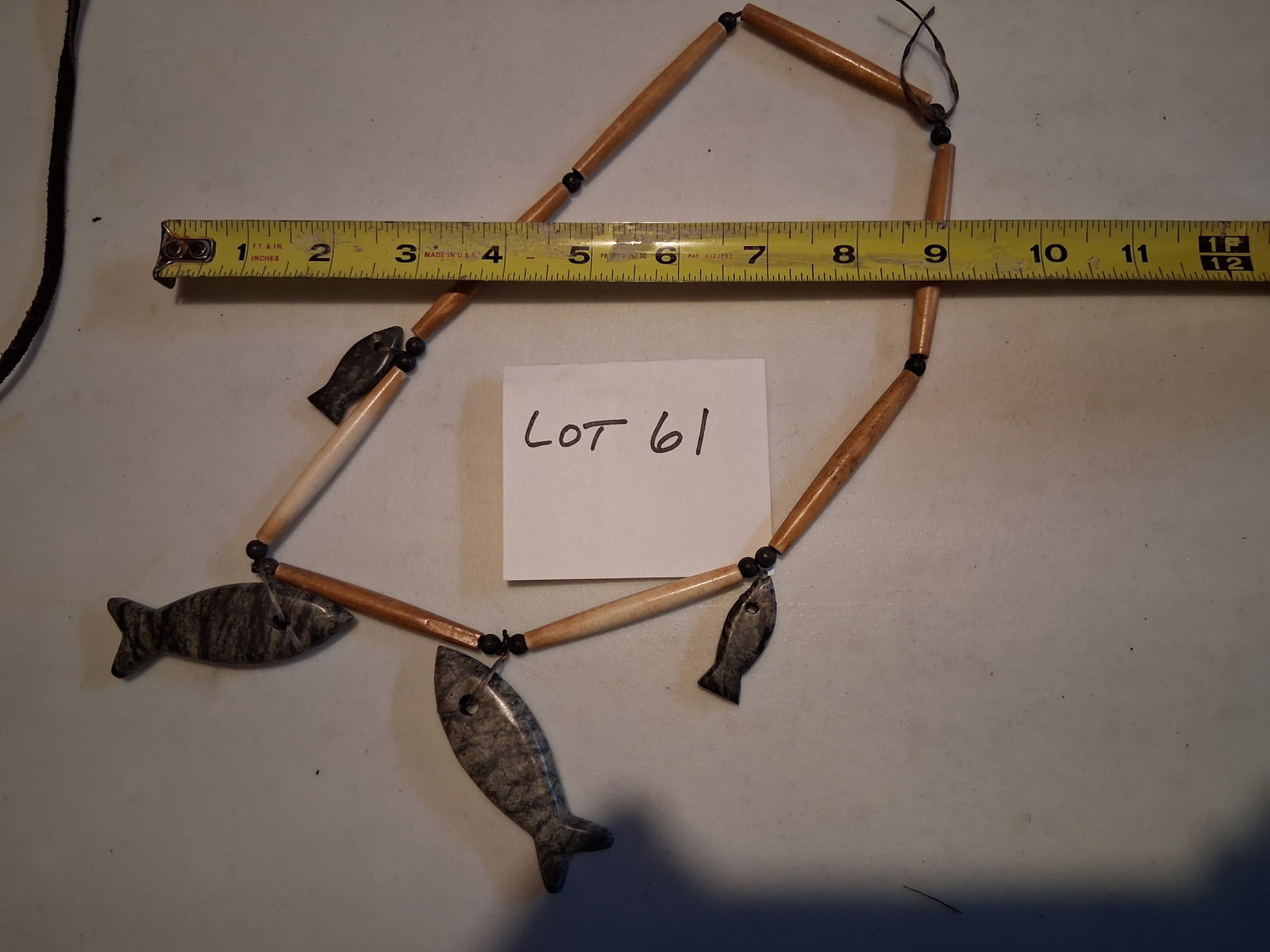 Necklace with Bone Beads and Fish Rock Pendants: Unknown origin. Unusual necklace consisted of bone beads and polished fish rock pendants.