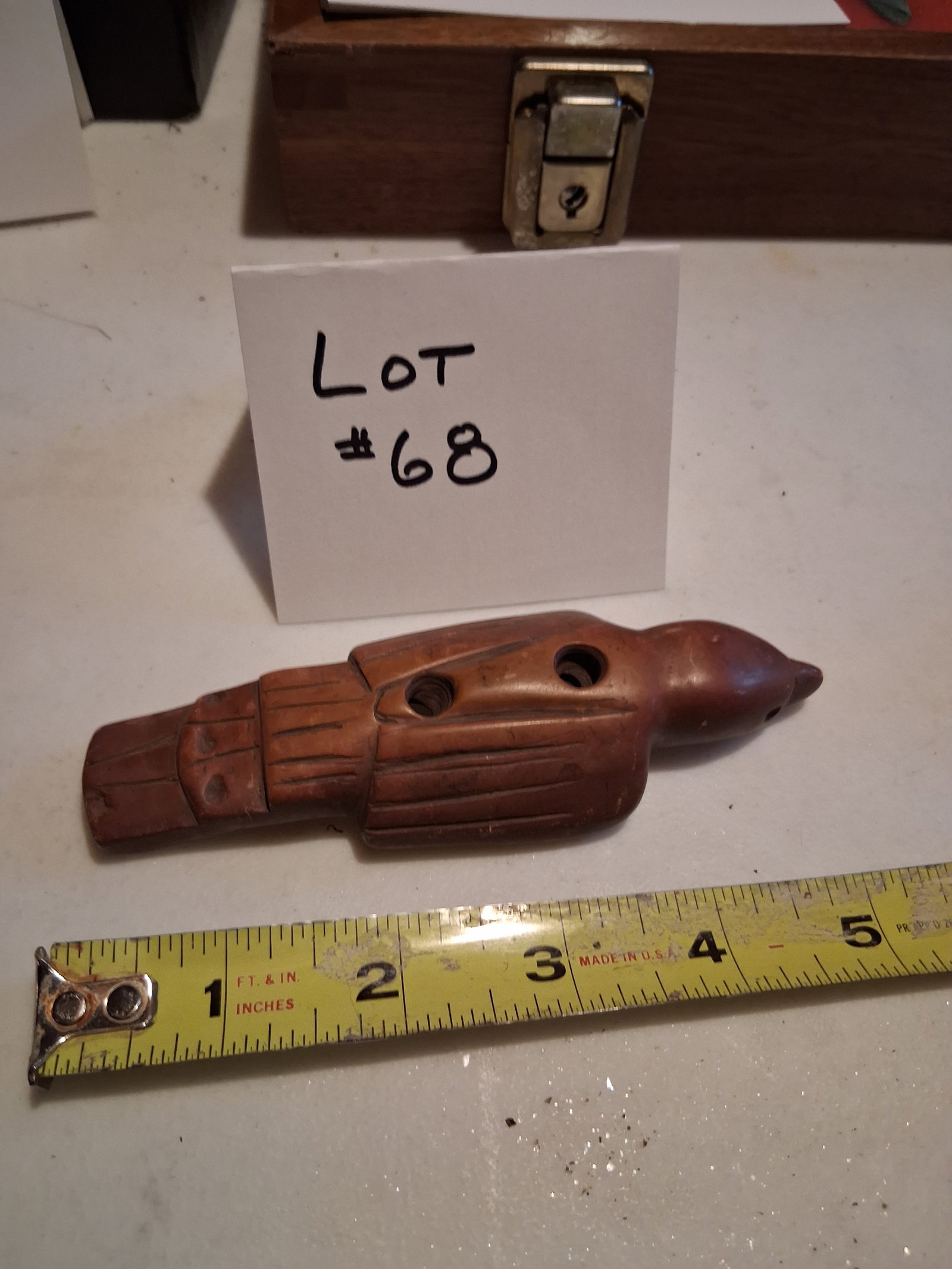 Carved Stone Fishing Weight: Carved stone fishing weight.