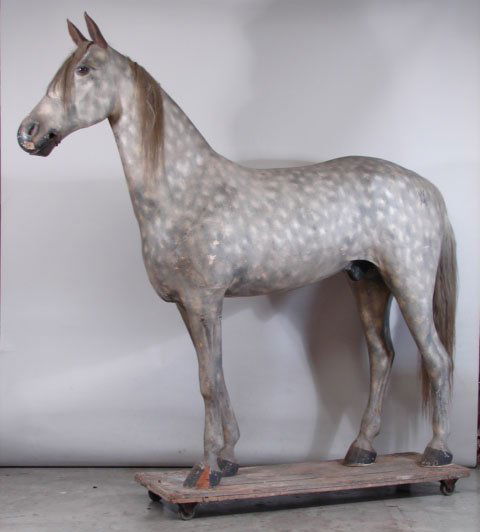 Tack Shop Display Horse: 19th Century. Life sized and mounted on original rolling platform. Exhibiting exceptional craftsmanship using sail canvas and Gesso exterior with original paint decoration. In dapple gray spotted styl
