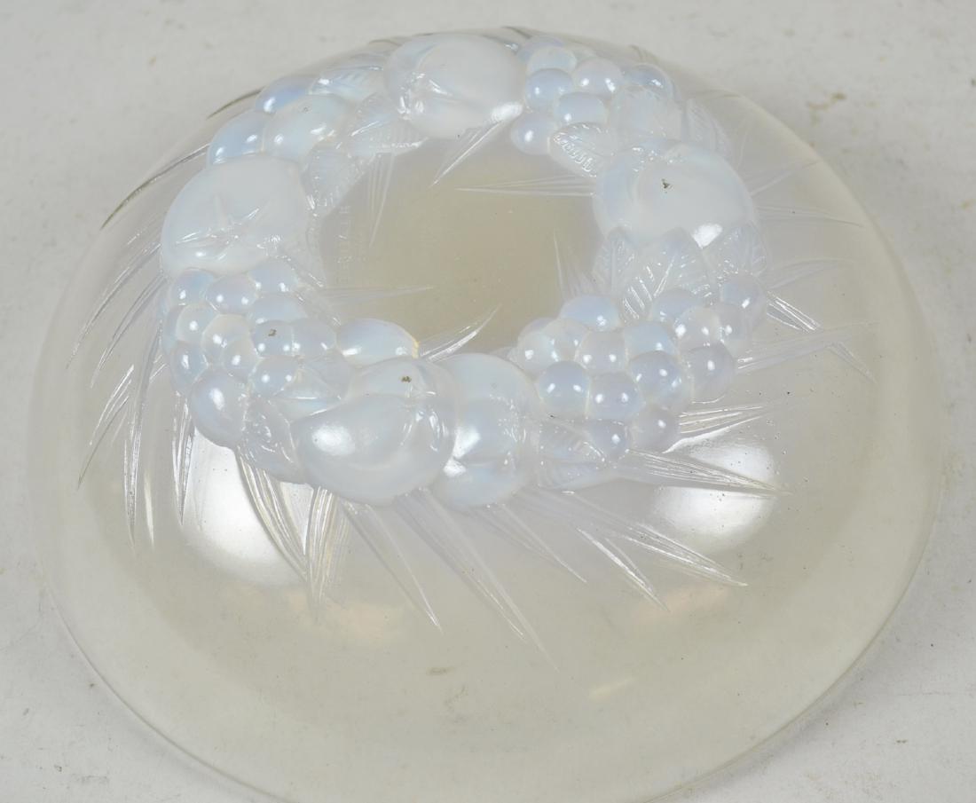 R. Lalique Pressed Glass Bowl: white iridescent with fruit on base, embossed signature, minor wear to base. 8 1/2" dia