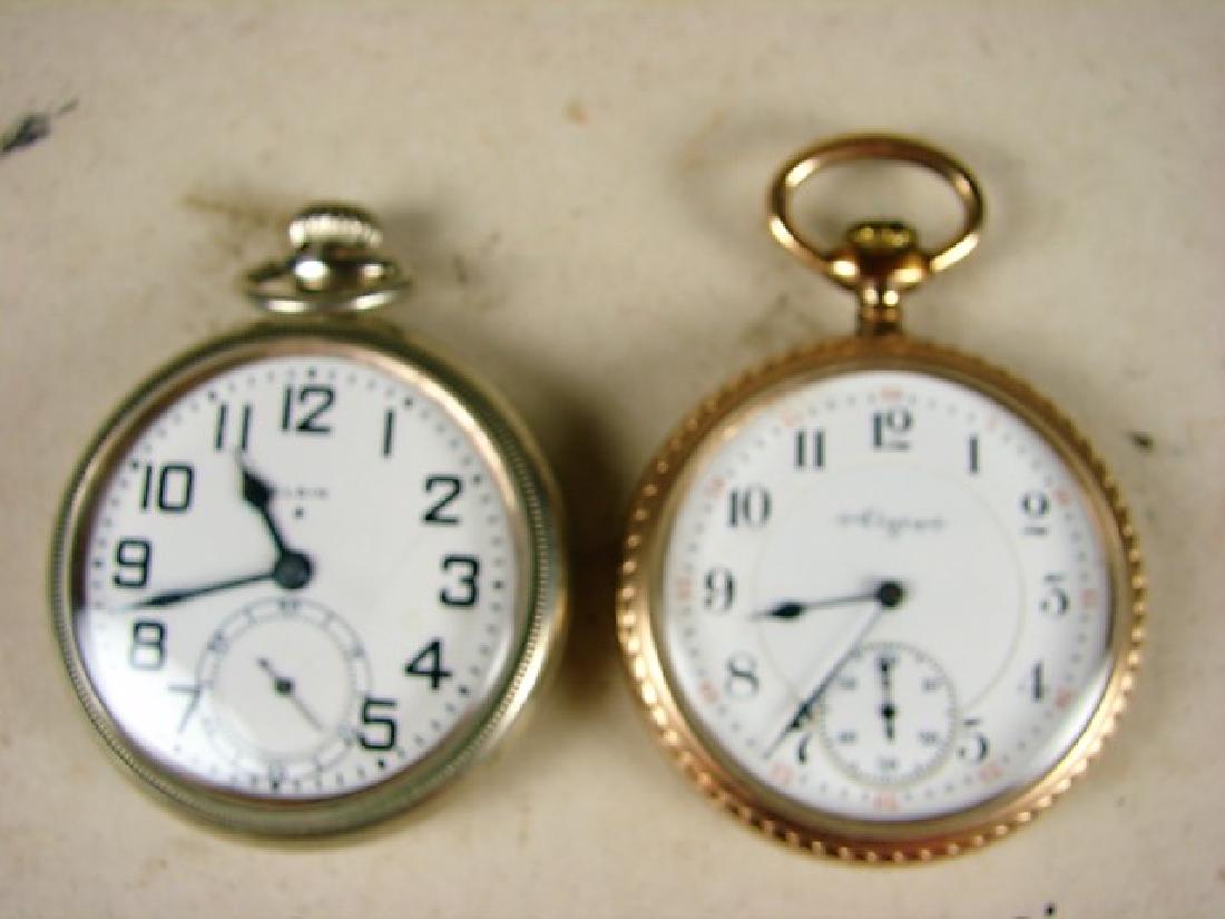 Two 17 Jewel Elgin Pocket Watches: One in gold filled case and one in a nickel case Nickel case has masonic symbol on back. Both running but not guaranteed. Wear to cases, gold filled has chip in dial.