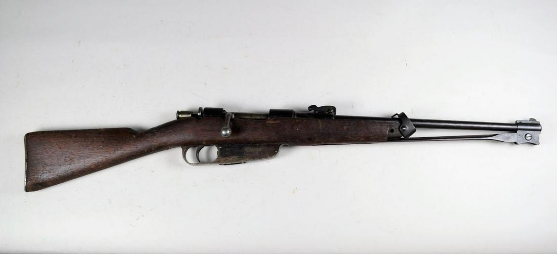 Italian Model 1938 Calvary Carbine*: in 6.5 x 52. Overall approximately 80% finish. Bore is very good with light pitting, stock is very good with moderate wear/bruising throughout. Front barrel band is loose but present and missing upper