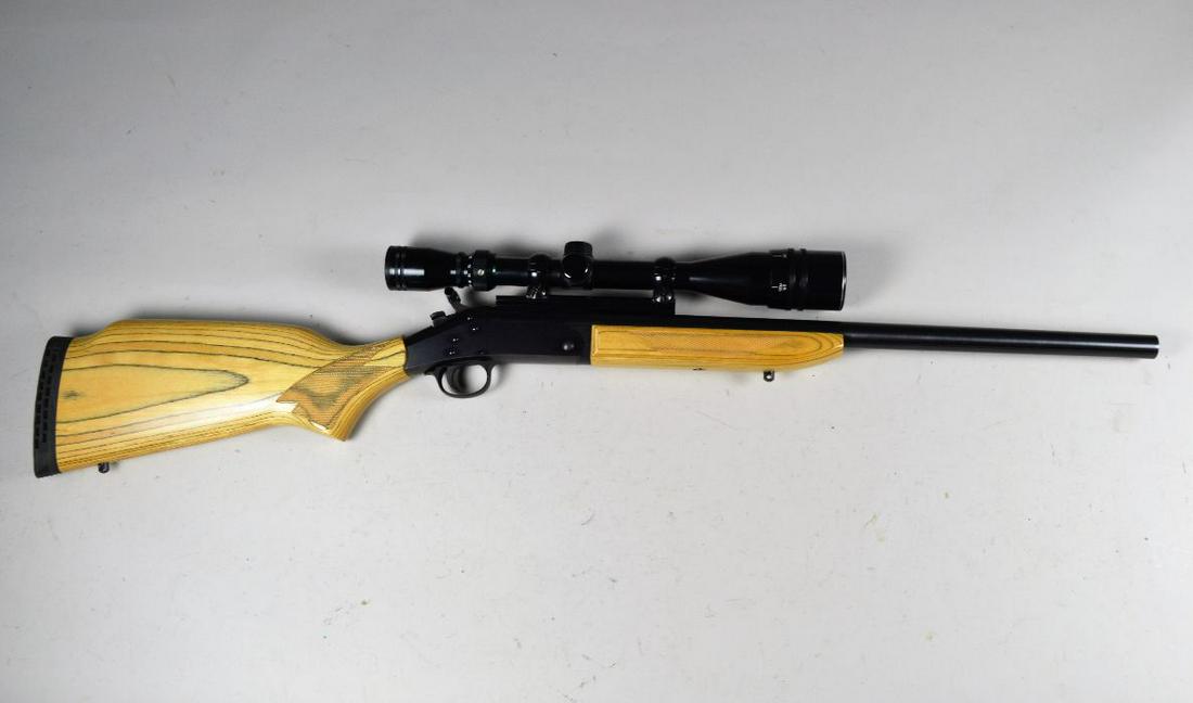 Harrington & Richardson Model SB2 Ultra Rifle*: in .223 Rem. Overall 99% finish with excellent bore and laminate wood stock. Mounted with Tasco 6-24 x 40 scope. Comes with original box. Barrel 22", overall 38". *Registration is required