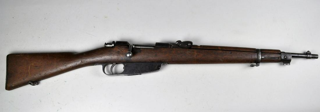 Italian Model 1891/28 Carbine*: in 6.5x52. Brown/grey gun with moderate pitting. Bore is very good with moderate pitting. Stock is good with moderate bruising throughout. Barrel 18", overall 36" *Registration is required