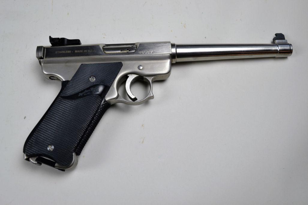 AMT Lightning Pistol*: in .22. Overall 98% stainless finish. Bore is very good with minor pitting. Pachmayr grips are excellent. In original box with extra magazine. Box shows heavy wear. Barrel 6 1/2", overall 10 1/2". *Re