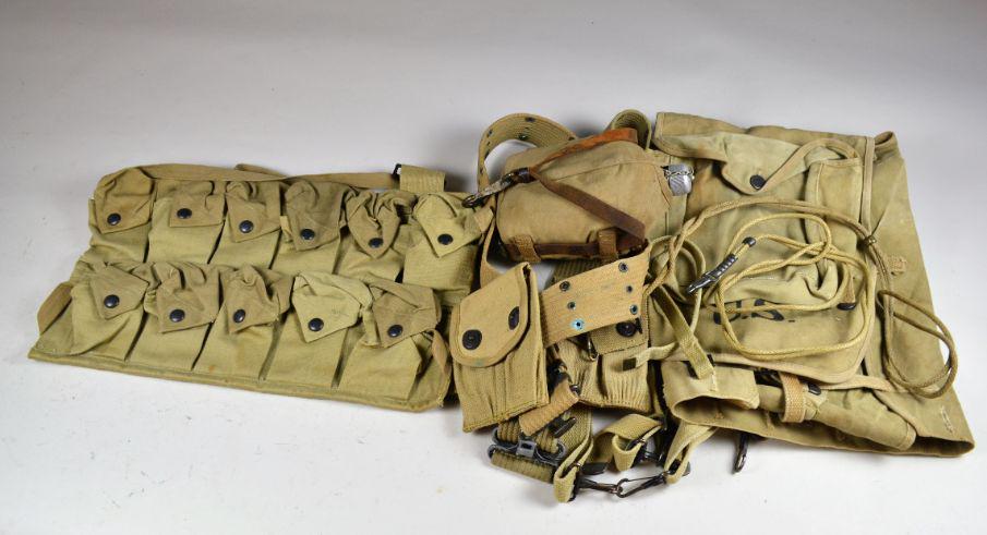 Group of WWI Gear: including canteen, grenade pouch, backpack, 2 web belts, 1918 mills .45 magazine pouch and 2 pistol lanyards. Minor wear from use