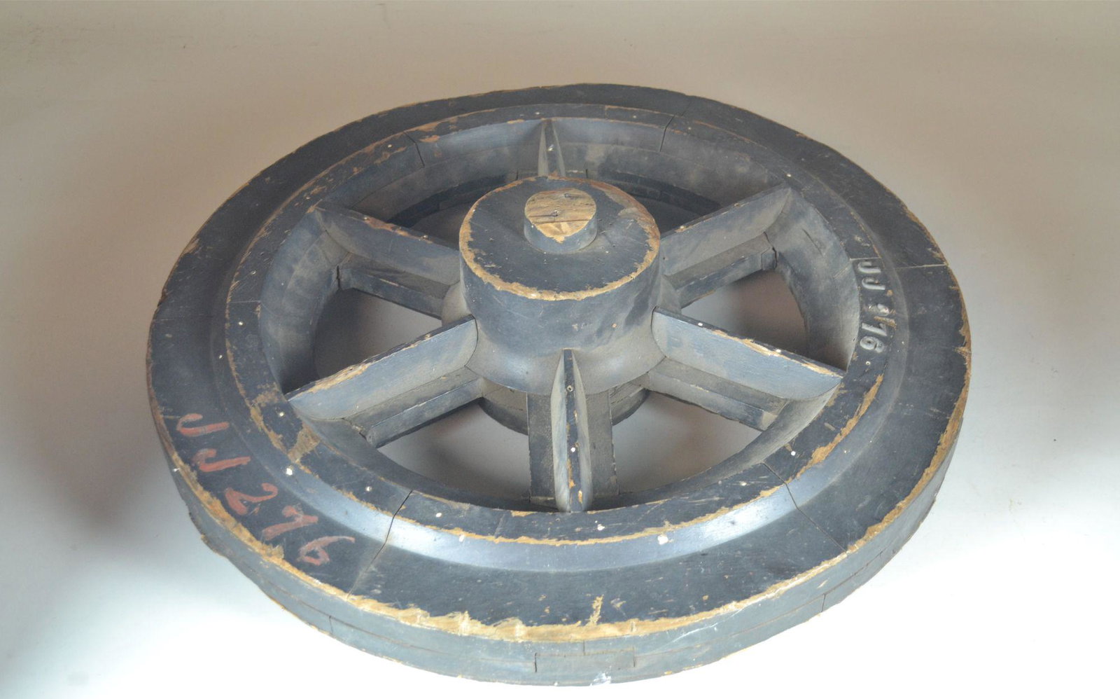 Wooden Foundry Mold for a Wheel: from Pulaski Iron & Foundry Company, Pulaski, VA. Has mold #JJ276 on side. Some loss of wood. Heavy wear from use. 24" dia.