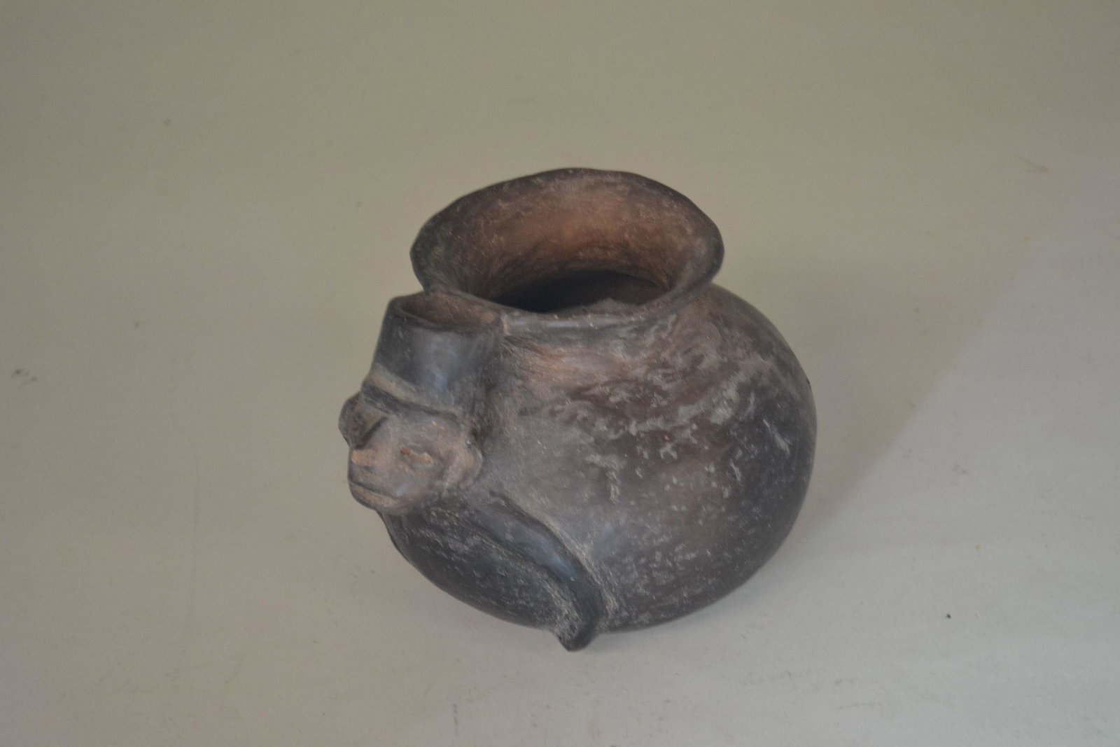 Mesoamerican Effigy Pot: with human face and arms. Head is hollow. Lite wear/scratches. 5" h x 6" w