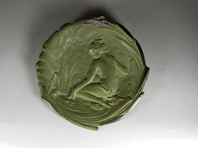 Art nouveau Painted Iron Wall Plaque: with maiden on edge of a pond. Wear to high spots and edges. No foundry marks. 8 1/2" dia