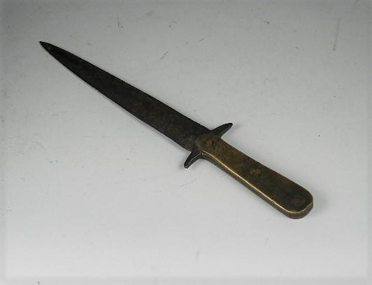 Confederate Side Knife: has brass grip attached with copper rivets to the tang. Guard is cut and beaten out form the blade. Heavy wear to brass. Blade is dark with minor nicks. Found in a house in Guildford County, North Car