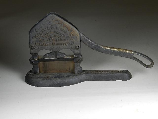Cast Iron Tobacco Cutter: patent Dec 1 1914. Marked Channel Commercial Co. Los Angles, Ventura, Santa Barbara, San Luis Obispo, CAL. Has crack in plate under cutter. Wear from use/rust. 8 1/2" h x 15 1/2" w