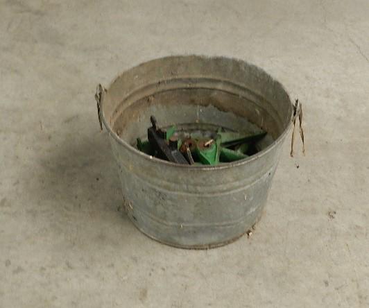 Galvanized Bucket of Items: sickle bar mower teeth