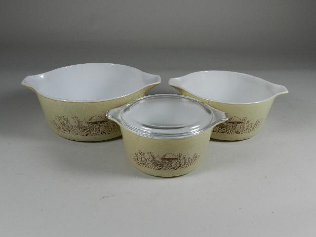 Vintage Pyrex 3 pc Nesting Bowls: one with lid, largest 11" w