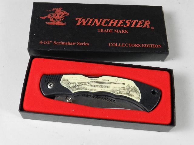 Winchester Scrimshaw Series Knife: has model 1897 shotgun on side, 4 1/2" closed