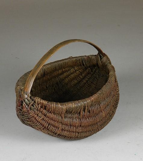 Unusual Twine Woven Virginia Basket: dated February 6, 1904. Bailing twine over oak ribs and has oak handle. Traces of red paint on ends. Carved across handle February 6, 1904. Wear to bottom, found in Botetourt County, Virginia. 8" h x 