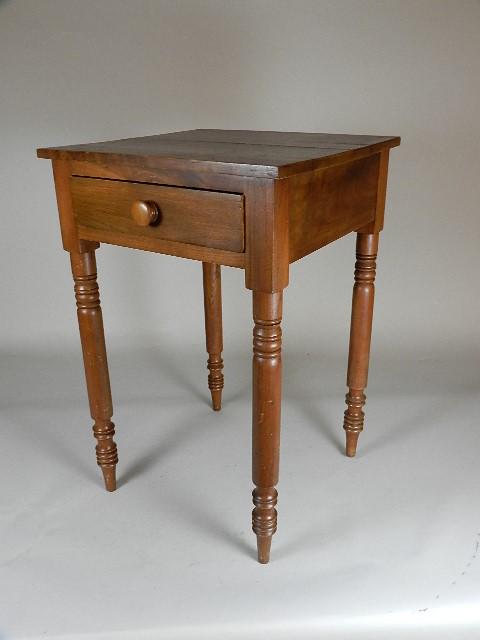 Walnut One Drawer Stand: dovetail drawer with poplar secondaries. Turned legs, two board top with age cracks in both boards, Refinished. 29" h x 19" w x 19" d