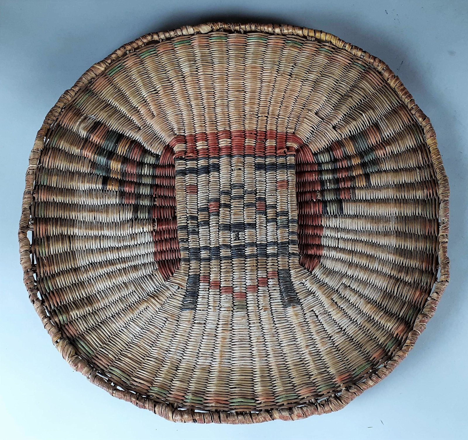 Early 20th Century Wicker Kachina Plaque: photo matched to the Triangle HC Ranch owned by Harry Knight. Copy of photo included with lot. Wear and fading to front side. Back side is bright. Edge wear with minor spots of damage. 13 1/2" dia. Fr